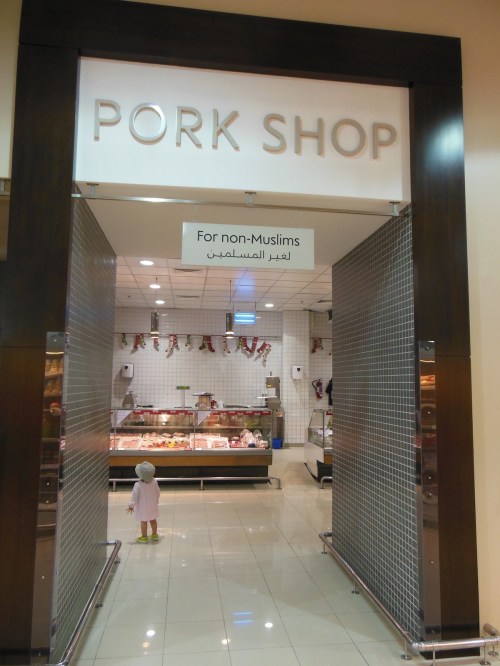 Pork Department: Islam is the national religion in the UAE, and laws are based around Sharia law. Muslims may not drink alcohol or eat pork (amongst other things). That being said, non-Muslims may buy pork at supermarkets and alcohol is served at hotels (though not in Sharjah).