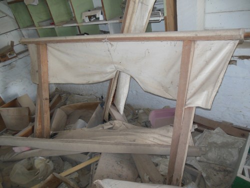  I spotted this cot in the abandoned hospital, and immediately recognized it as a Cholera Cot.  These are one of the things doctors learn about in med school but will never see in the US.  Cholera causes MASSIVE fluid loss by diarrhea.  Cholera cots are designed with a hole in them so a bucket can be placed under the patient to measure fluid loss. Replacement of fluid and electrolytes with Oral Rehydration Therapy is amazingly effective for this otherwise very deadly disease. 